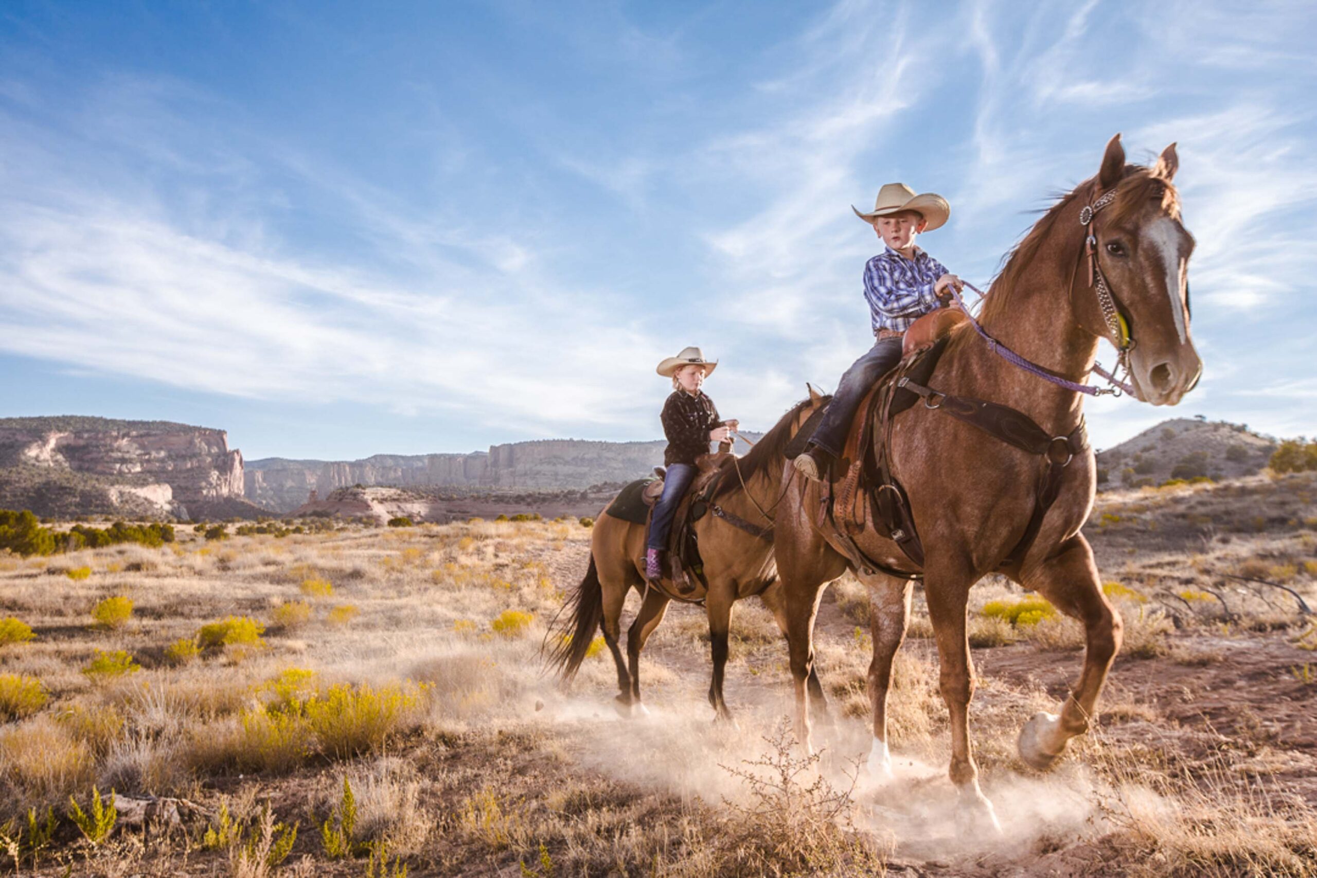 Kids walking riding horses in Fruita