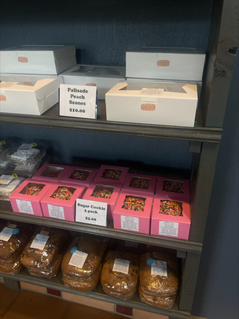 Scones, cookies and bread on shelves at Hailie's Oven.