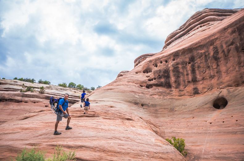 A family of five hikes up the Colorado National Monument.