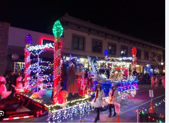 A float with candy canes and Christmas lights drives in Downtown Fruita in the 2022 Parade of Lights.