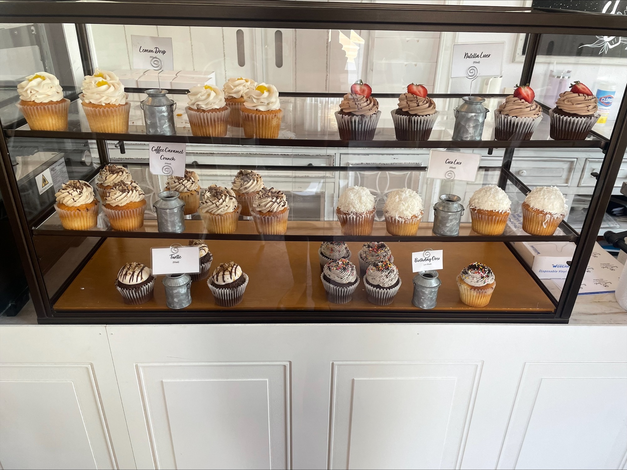 A glass case full of cupcakes from Sweet & Simple.