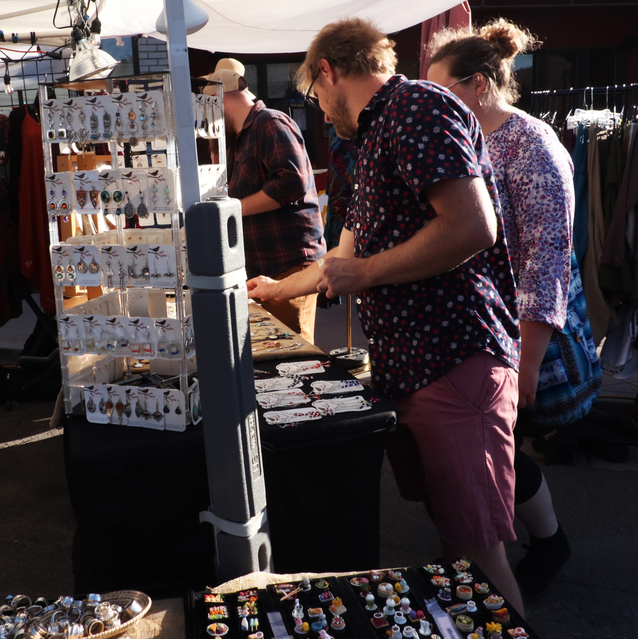 People looking at jewelry.
