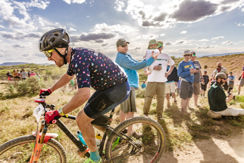 A man riding his bike in a race.