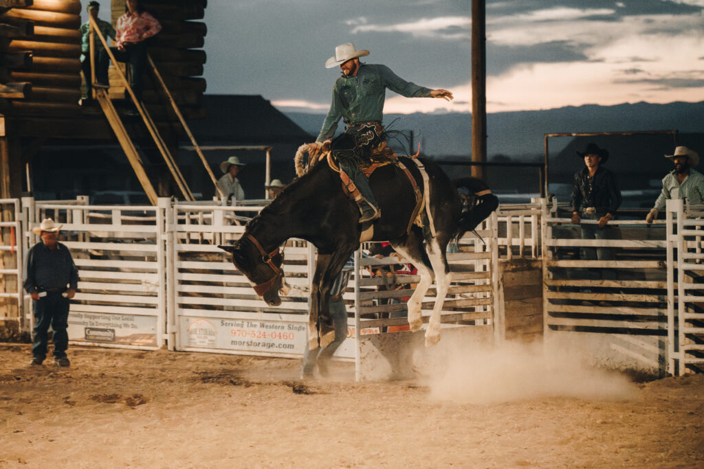 A man riding a horse at a rodeo