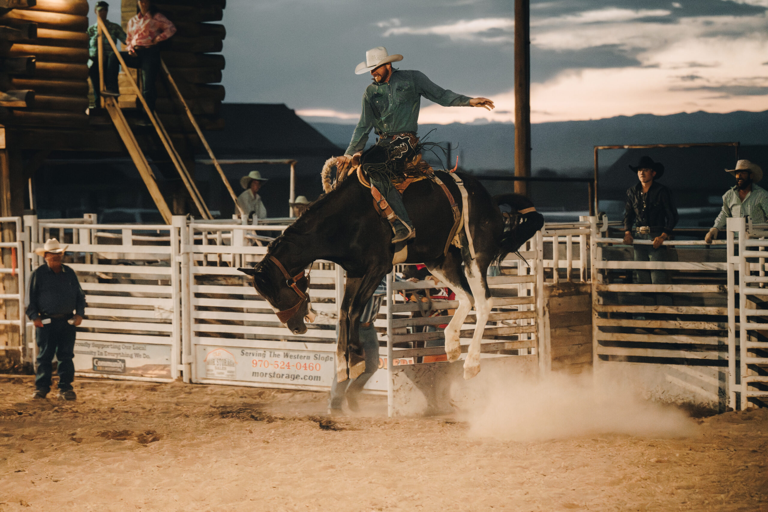 A man riding a horse at a rodeo