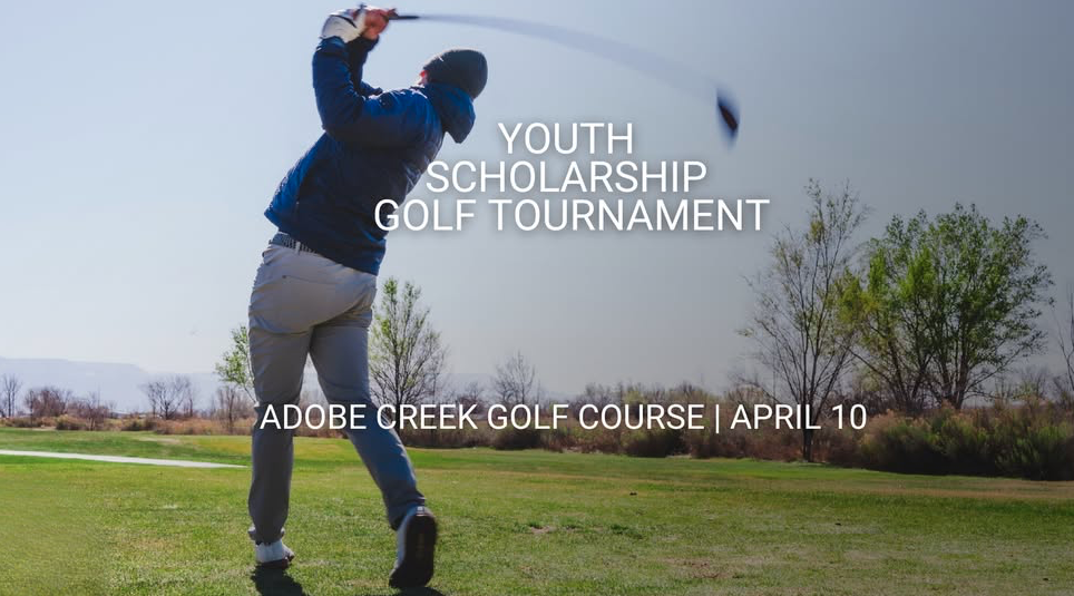 A man in the middle of a golf swing.